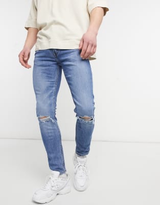 levi's 519 skinny distressed jeans