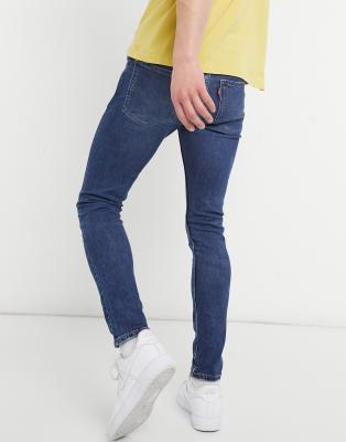 levi's 519 skinny distressed jeans