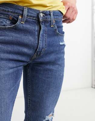 levi's 519 skinny distressed jeans