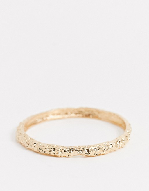 Liars and Lovers molten gold metal bangle