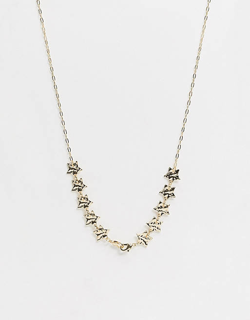 Liars & Lovers face covering chain in gold with star details