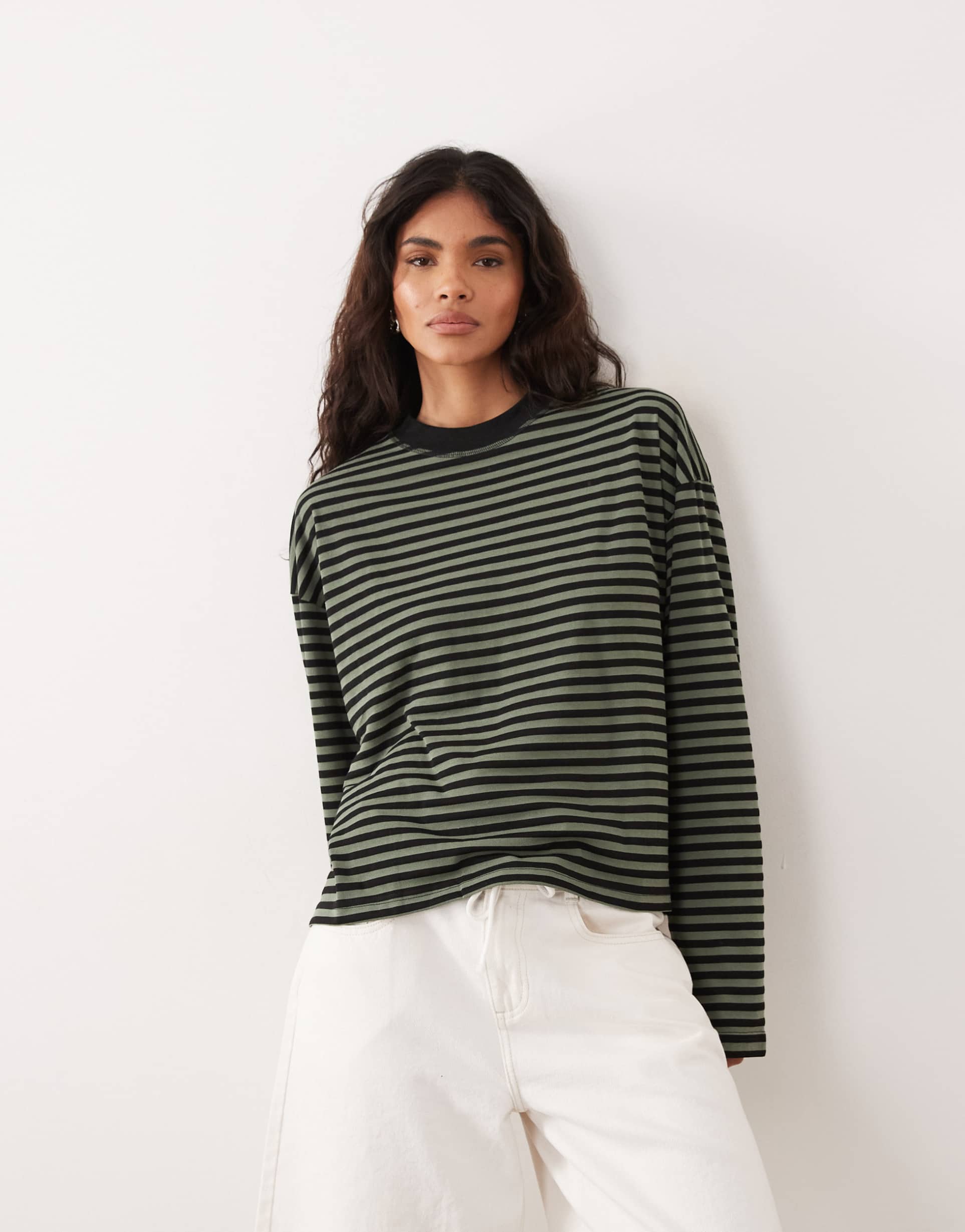 lioness bloom cotton blend long sleeve crew neck boxy t-shirt in green & black stripes