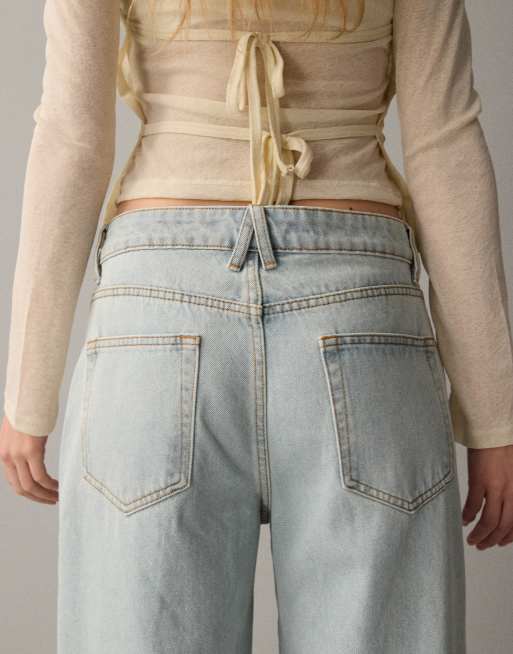 Lioness Penny asymmetric button detail relaxed leg jeans in light wash, 4 of 7