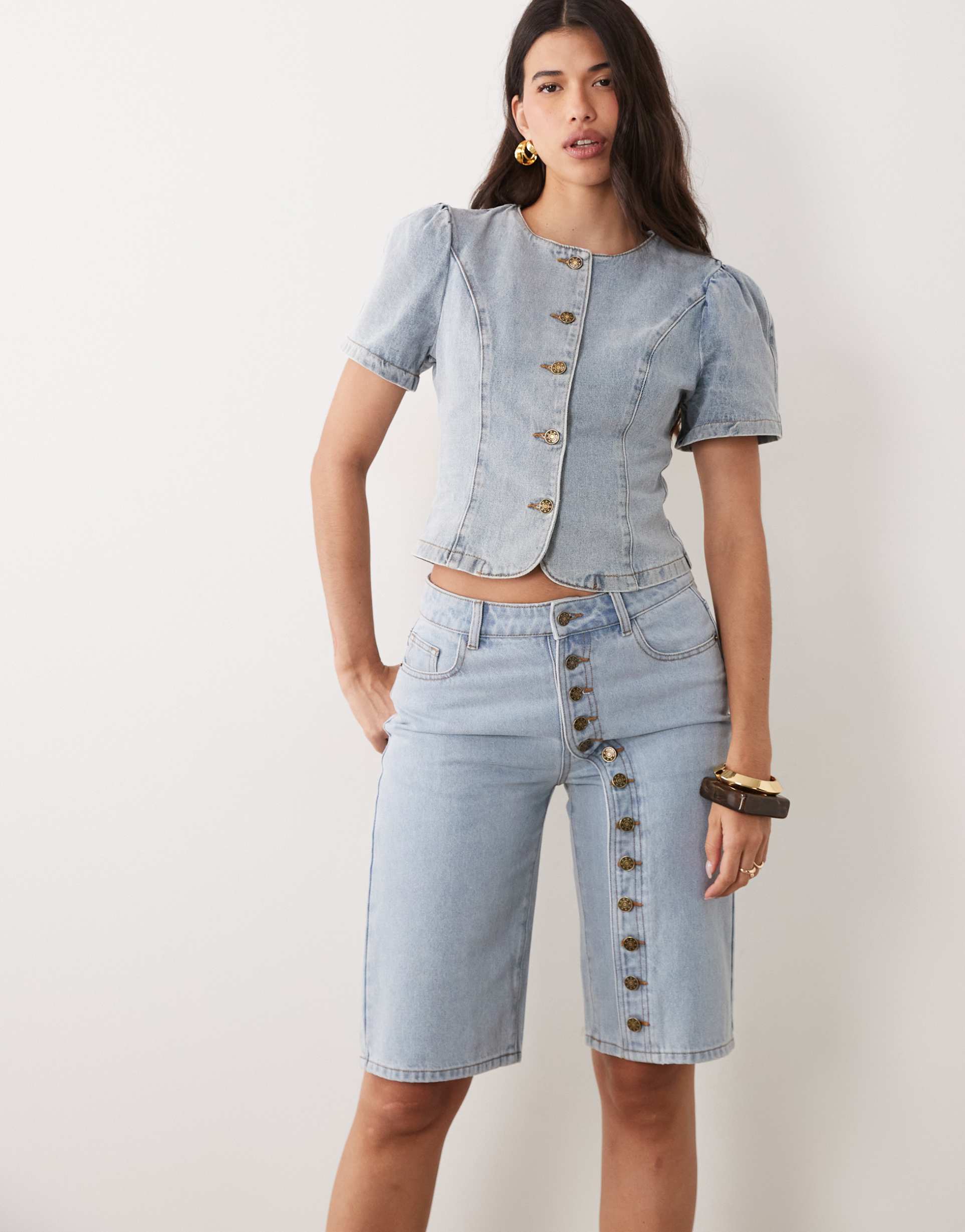 lioness penny exclusive asymmetric button detail relaxed leg jorts in light wash denim