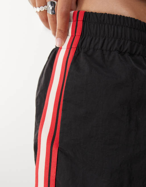 Lioness Sevigney elastic waist side stripe windbreaker jorts in black, 5 of 5