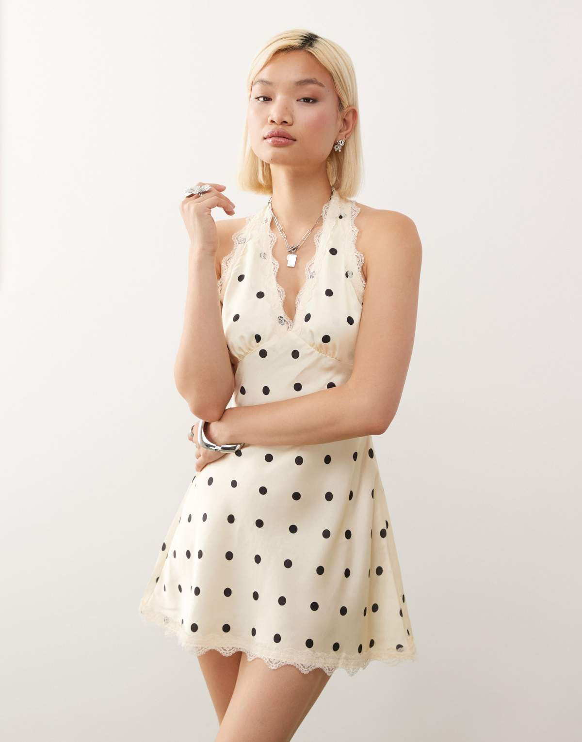 Lioness Stars Align halterneck lace trim open back satin mini dress in cream and black polka