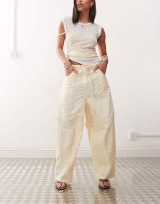 Lioness Lioness tie waist barrel leg trousers in buttercream yellow