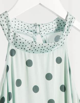 green polka dot halter neck dress