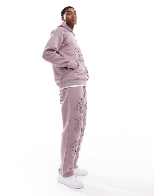 Liquor N Poker all over motif straight leg trackies in berry mix (part of a set)