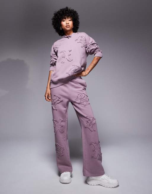 Liquor N Poker all over motif straight leg trackies in berry mix (part of a set)