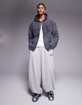 Liquor N Poker low rise camo baggy jeans with stud detail in multi