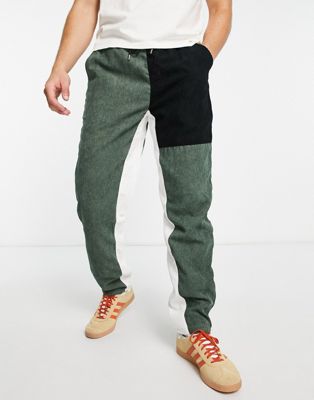 Liquor N Poker co-ord trousers in black and sage spliced cord