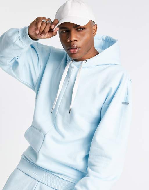 Liquor N Poker oversized spliced hoodie in light blue with elongated ...