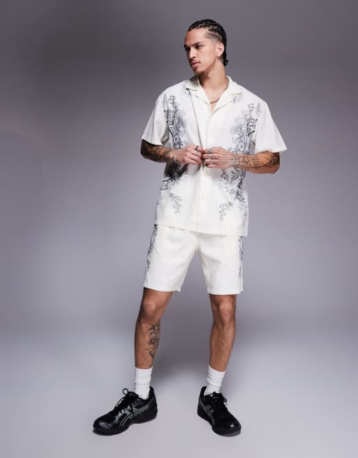 Liquor N Poker - Pantaloncini bianco sporco con stampa di emblema reale