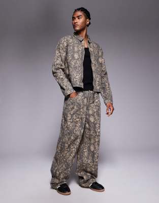 Liquor N Poker Liquor N Poker relaxed baggy jeans co-ord in olive snake print-Multi