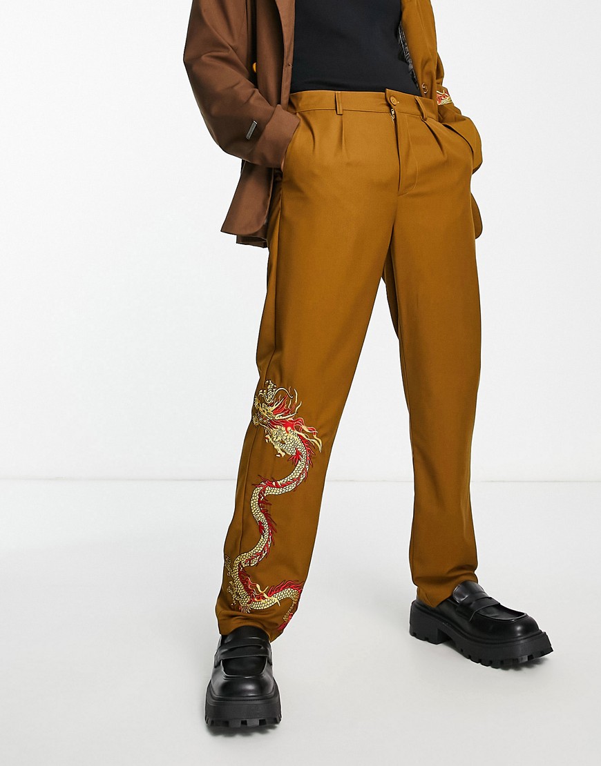 Liquor N Poker relaxed fit suit pants in brown with placement dragon print