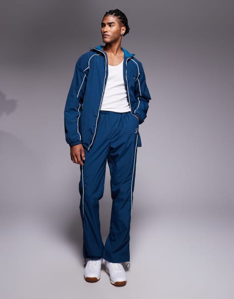 Liquor N Poker relaxed nylon jogger co-ord with logo and piping detail in navy