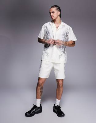 Liquor N Poker Liquor N Poker royal emblem print motif shorts co-ord in off white