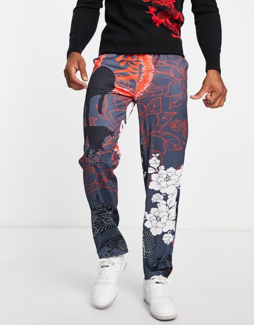 Liquor N Poker straight leg plisse trousers in light grey with all over dragon print