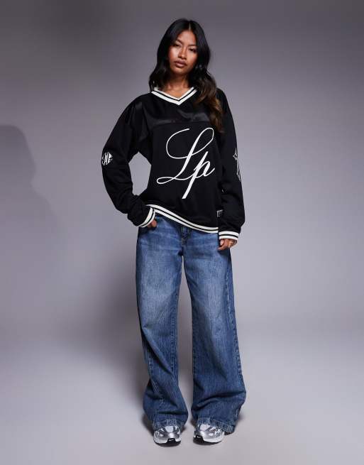 Liquor N Poker varsity long sleeve t-shirt with Rebel 13 logo in black