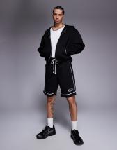 Nike C1TY trainers in black and white
