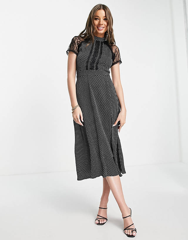 Liquorish - a line midi dress in lack black polka dot print