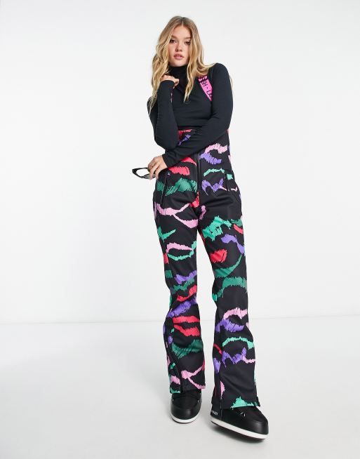 Liquorish Ski waterproof salopettes in abstract multi colour print