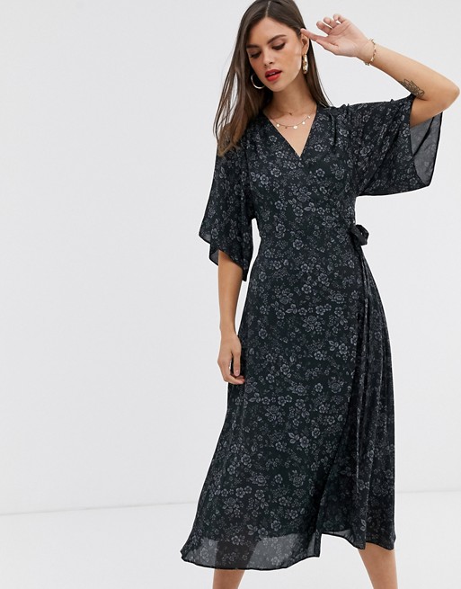 Liquorish wrap front midi dress with tie belt and flutter sleeves in black floral