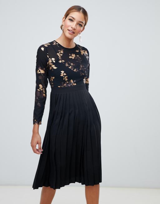Little Mistress - Mini-jurk met glimmende print en geplooide rok in zwart
