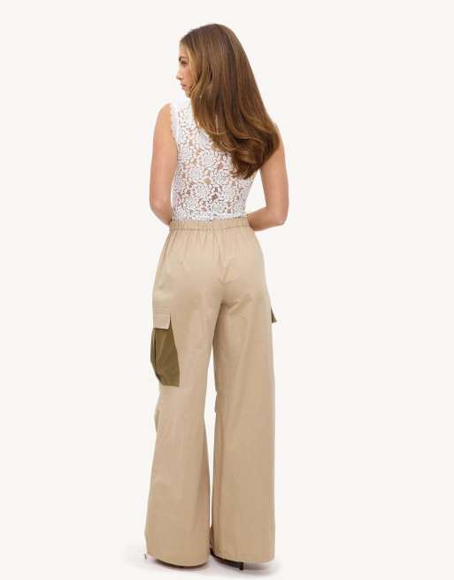 Loavies Captured in time parachute trousers with green pockets in sand, 4 of 4