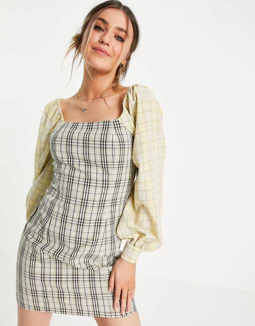 Lola May - Offshoulder-minikjole i blandet, ternet print