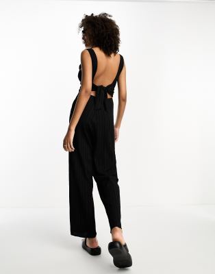 Lola May scoop back bow jumpsuit in black