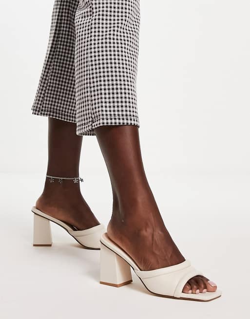London Rebel block heel mules in cream ASOS