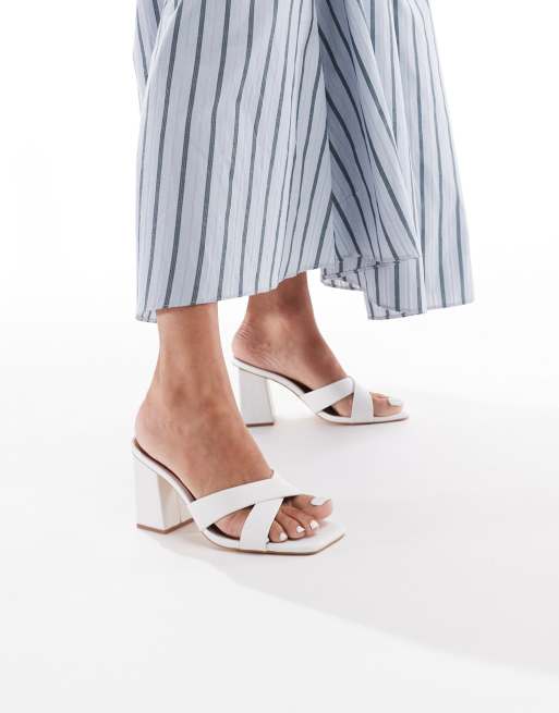 London Rebel crossover detail mules with high heel in white