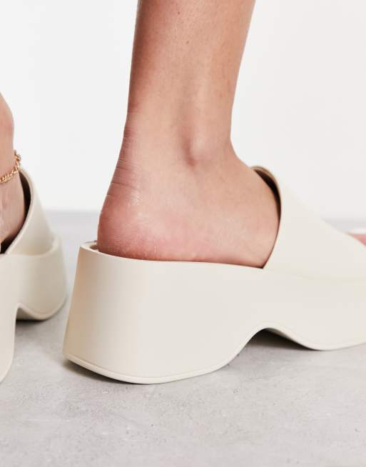 London Rebel flatform square toe sliders in cream ASOS