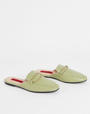 London Rebel slip on mules in green with chain