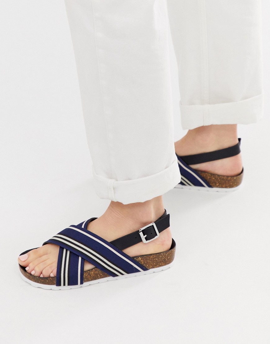 London Rebel – Sportiga platta sandaler med korsade remmar-Marinblå