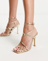 Simmi London Eloise heeled sandals with leg wrap in gold | ASOS