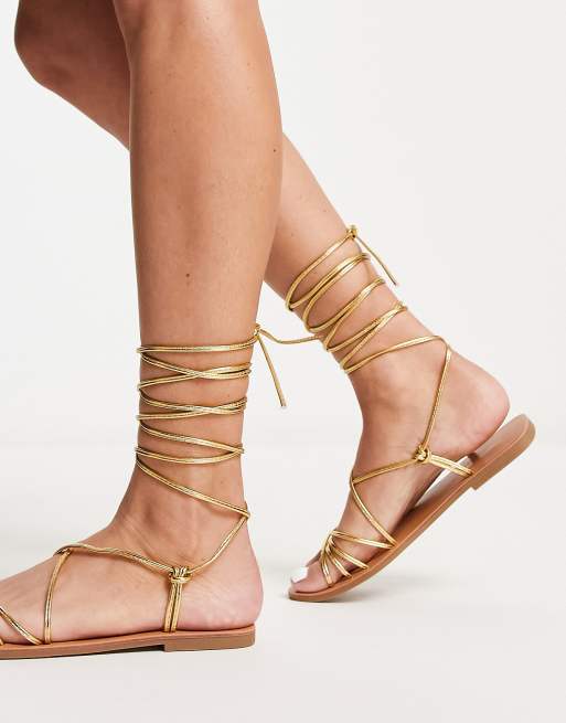 Gold tie store up leg sandals