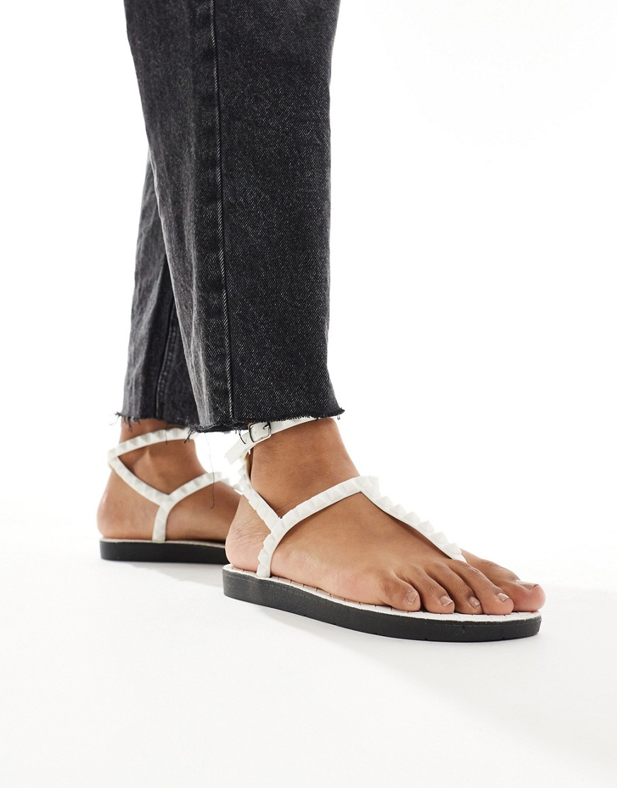 London Rebel studded t-bar ankle strap jelly sandals in white