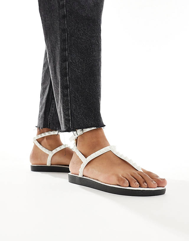 London Rebel - studded t-bar ankle strap jelly sandals in white