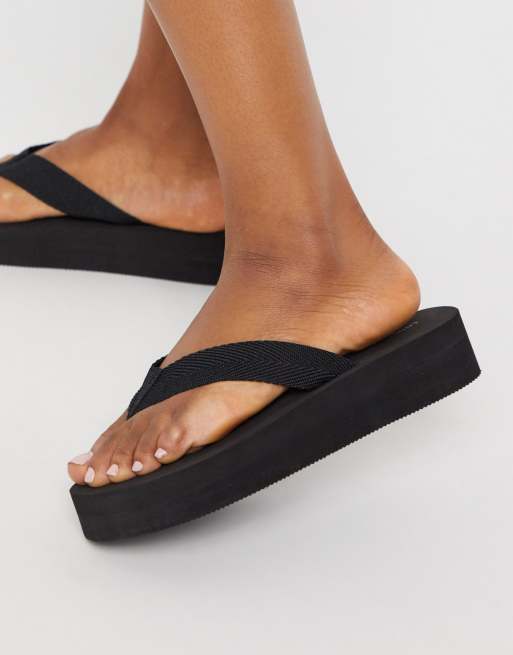 London Rebel thong flip flops in black drench ASOS