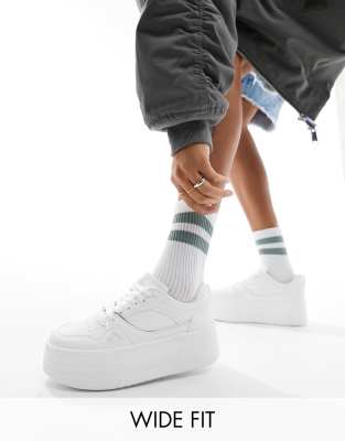 London Rebel Wide Fit London Rebel Wide Fit chunky panelled flatform trainers in white