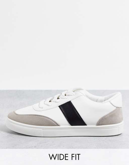 White trainers black store stripe