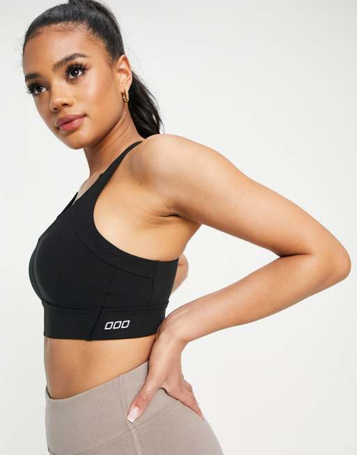 New Balance linear logo medium support sleek sports bra in black