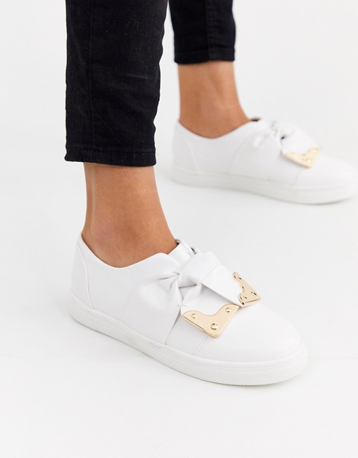 Lost Ink bow plimsoll trainers