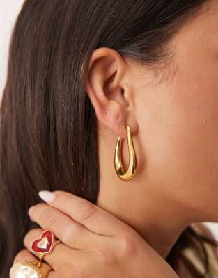 LOST SOULS Lost Souls irregular hoop earrings in 18ct gold plated stainless steel