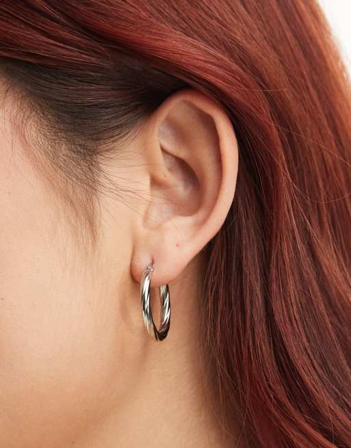 Lost Souls stainless steel twisted hoop earrings in silver tone