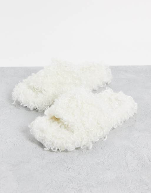 Loungeable curly faux furl slides in cream