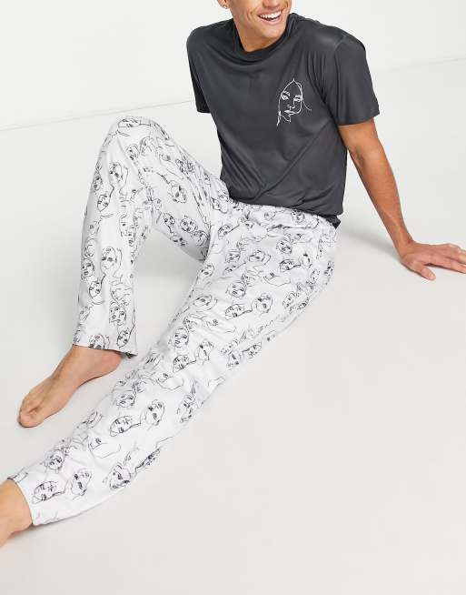 Loungeable - Lange pyjamaset met gezichtenprint in zwart en wit